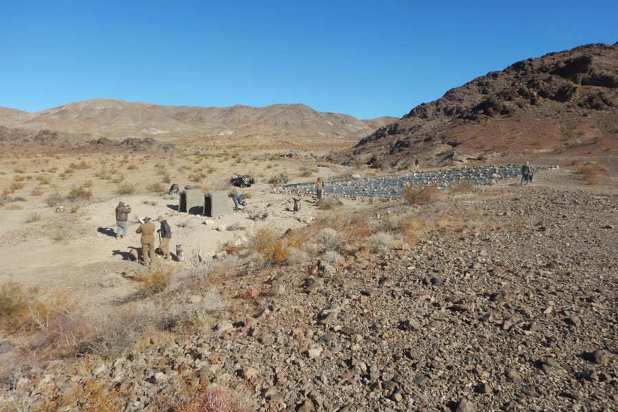 A finished rain collection apron and tanks on a desert bajada