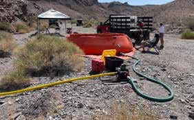 Big Red discharging water into the bladder tank